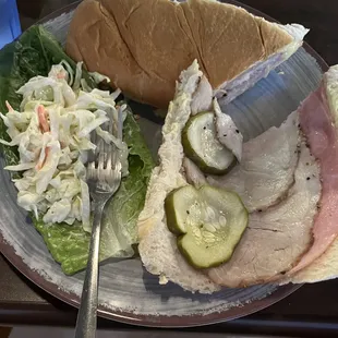 Inside Cuban with slaw, bread beside it.