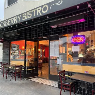 Patio seating and restaurant entrance.