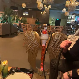 a man sitting in a chair with a hook