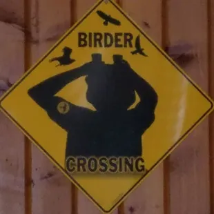 a birder crossing sign