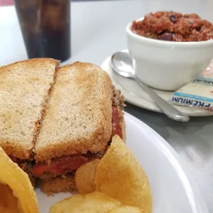 The day&apos;s special of a meatloaf sandwich and chips plus a bowl of chili and Pepsi.
