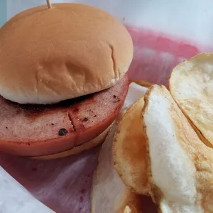 Fried bologna sandwich with chips.