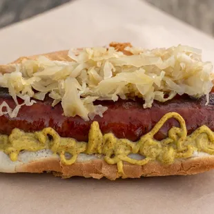 Farm Raised Local Keibasa Organic Kruat and homemade Mustard on a Breadworks Bun