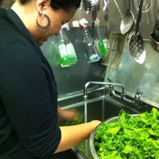 My friend washing the mustard greens