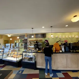 a woman standing in front of the counter