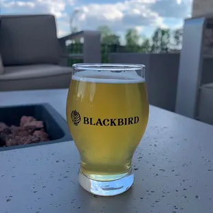 a glass of beer on a table