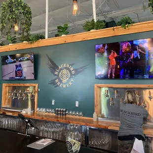 a bar with a large screen tv