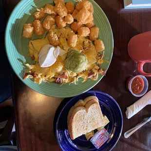 CA omelette, scrambled with tater tots and sourdough toast.