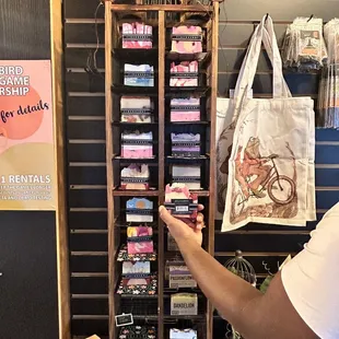 a man pointing at a display of items