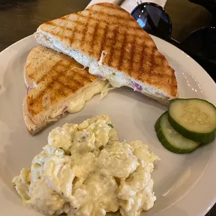 Tomato and cheese sandwich with potato salad