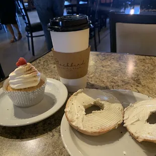 a cup of coffee and a bagel
