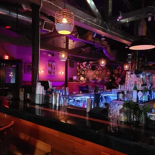 a bar with purple lighting