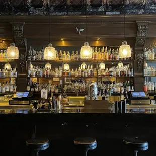 a bar with a lot of bottles of alcohol