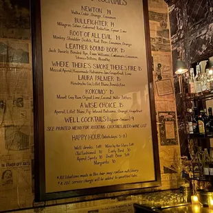 Cocktail menu on the wall. I loved the Newton cocktail. It was delicious.