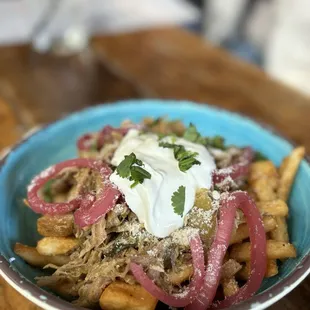 a plate of food on a wooden table