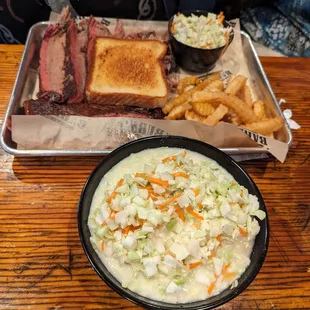 Brisket, ribs, pulled pork, Texas toast, french fries, and a large side of cole slaw