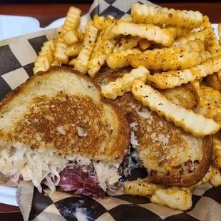 a grilled sandwich and fries