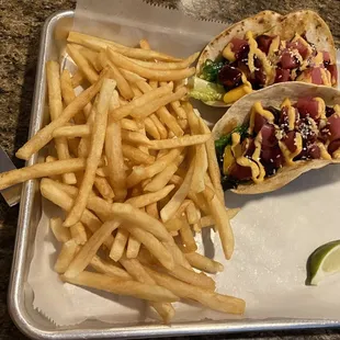 Poke tuna tacos, on flour tortillas, w/fries.