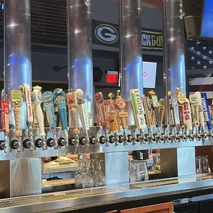 a row of beer taps