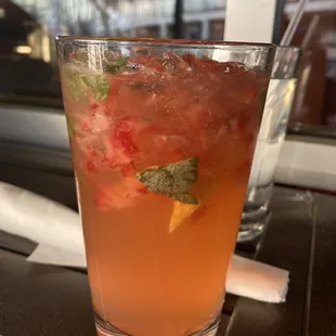 a closeup of a drink in a tall glass