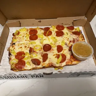 Sad pizza with the embedded salad dressing.