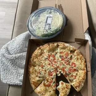 Large garden salad with balsamic dressing. A medium Margareta pizza