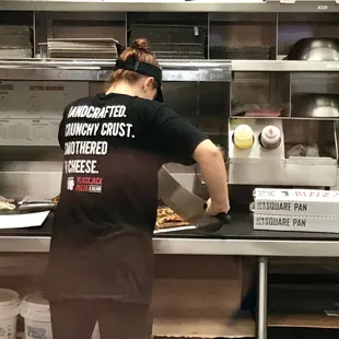 a woman working in a restaurant kitchen