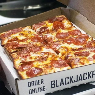 a box of pepperoni pizza