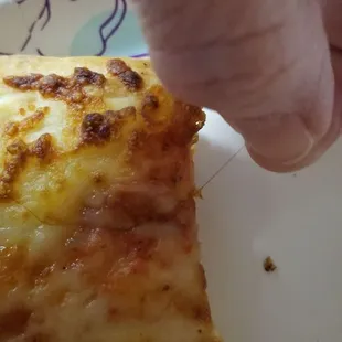 Hair sticking out of crust