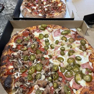 Medium bacon, sausage and pepperoni and a large half Canadian bacon and pineapple half sausage pepperonis, mushroom, and jalapeños .