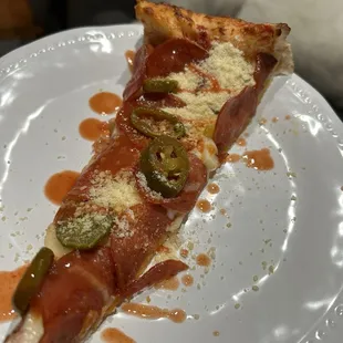 Pizza with pepperoni and jalapeño