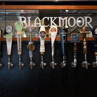 a row of beer taps