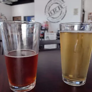 two glasses of beer on a table
