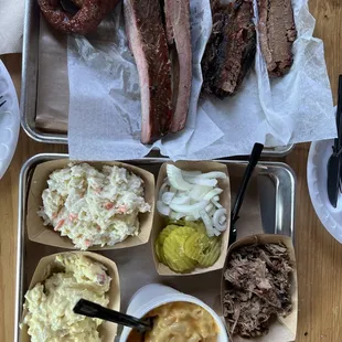 Brisket, pork ribs, sausage rings, potato salad , coke slaw, Mac and cheese