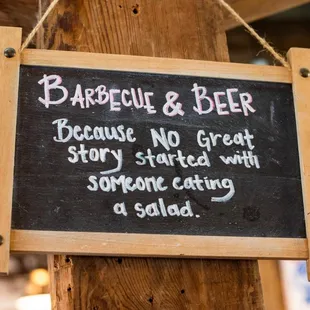 a chalkboard with the words barbecue and beer because no great story started with someone eating