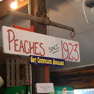 a sign hanging from a pole