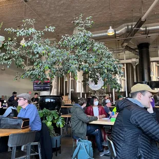 a group of people sitting at tables