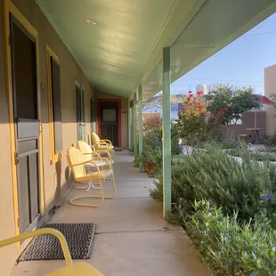 Outside seating in front of the rooms.