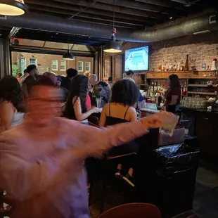 a crowd of people at a bar