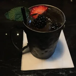 The Secretariat- Buffalo Trace, lime juice, ginger beer, mixed berries