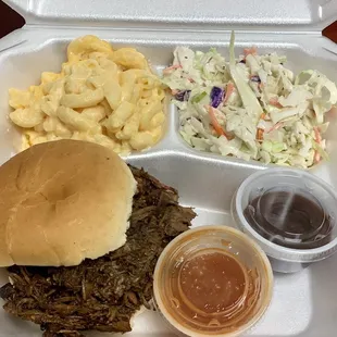 Beef brisket sandwich with Mac and cheese and Cole slaw