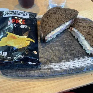 The Reuben sandwich with ripple potato chips on a neat tray!