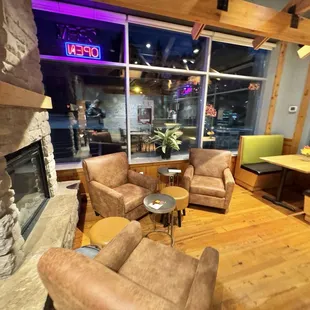 Soft seating area with fireplace.