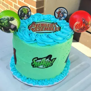 8" three layered marble cake iced with buttercream icing themed with avengers!!!