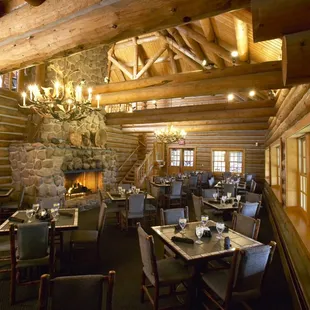 a dining room with a fireplace