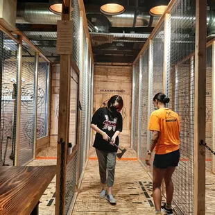 Toni teaching our daughter the joy of ax throwing.