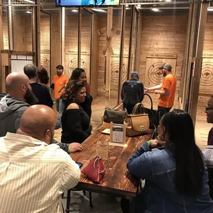 a group of people sitting around a table
