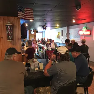 people sitting at a bar