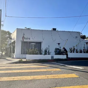 a man walking across the street