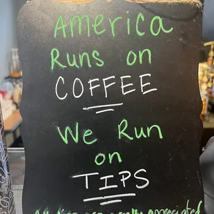 a sign that reads america runs on coffee we run tips